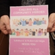 Person holding a leaflet for community councillor recruitment in Salehurst & Robertsbridge, calling for "community heroes.