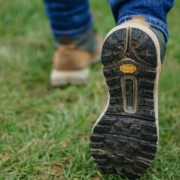 person wearing brown-and-black shoes
