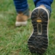 person wearing brown-and-black shoes