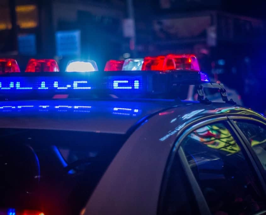 blue car on the street during night time