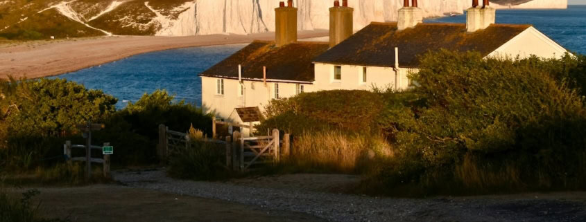 a house with a large body of water in the background