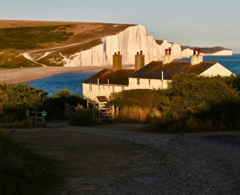 a house with a large body of water in the background