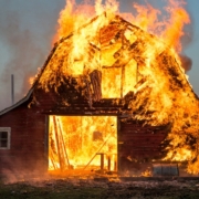 brown wooden house near fire